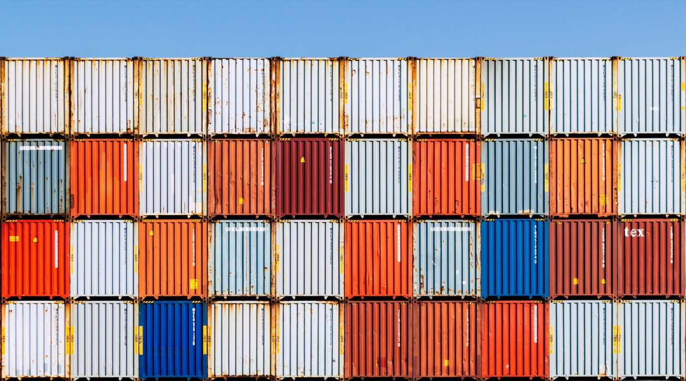 Stacked shipping containers at a Mozambican port terminal